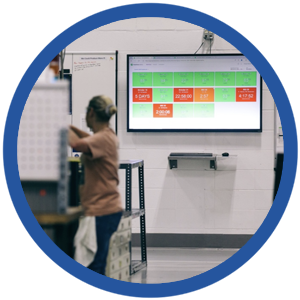 manufacturing worker looking at real time screen