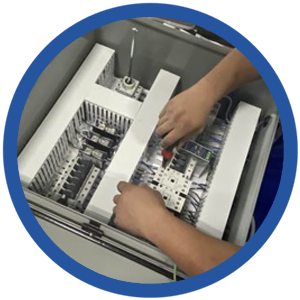 hands working on a control panel