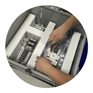 hands working on a control panel